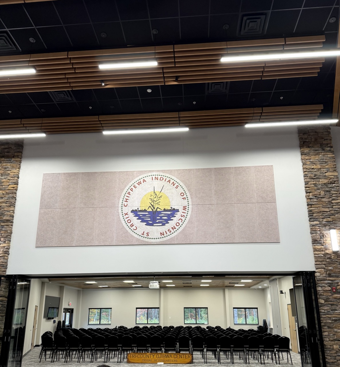 Fabric wrapped acoustical panels in an auditorium setting