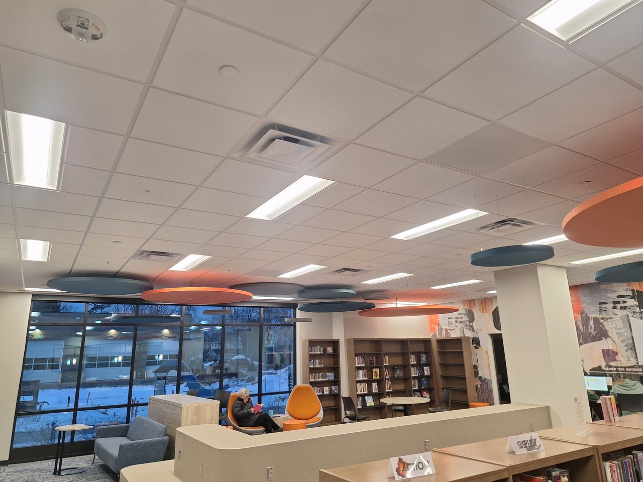 Suspended acoustical tile ceiling
