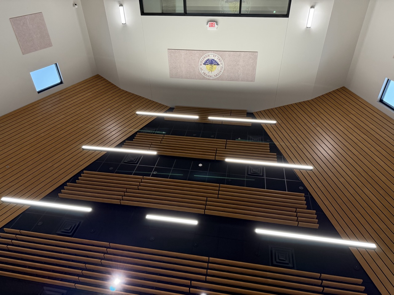 Suspended wood slat ceiling with integrated lighting viewed from below